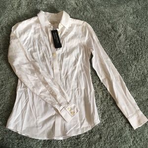 White, button down, women’s dress shirt.
